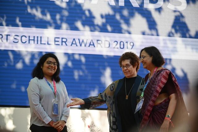 Pooja Ichplani (L) and Archna Kumar received the award from Janet Wasko Pooja Ichplani (L) and Archna Kumar received the award from Janet Wasko